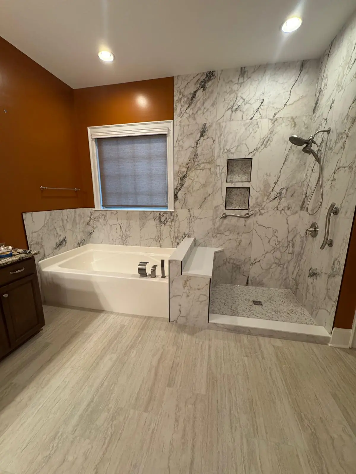 Large marble tile shower and bathtub remodel