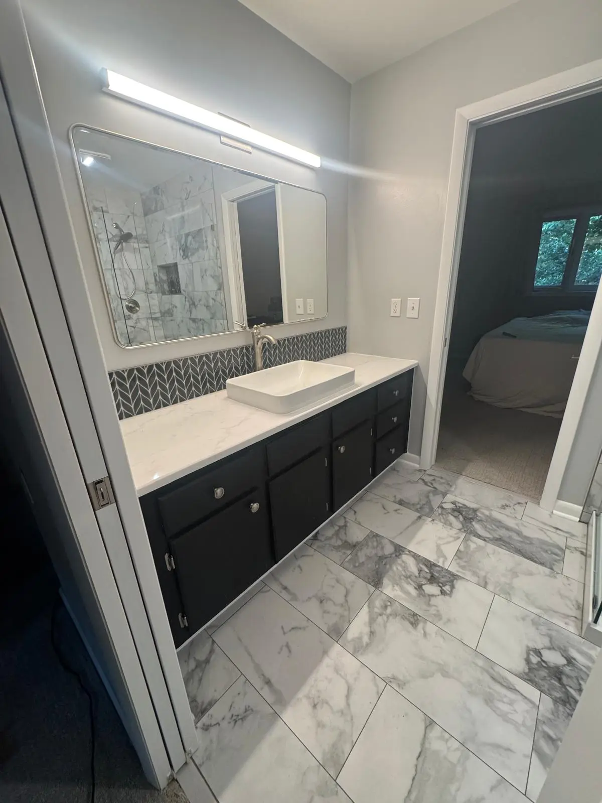 Bathroom vanity and marble-look floor tile installation